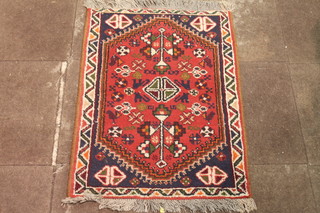 A brown ground tribal rug 38" x 28"