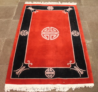 A red ground Chinese rug 71" x 47"