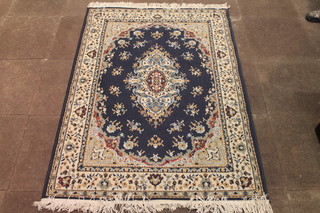 A blue ground machine made Persian style carpet 66" x 47"