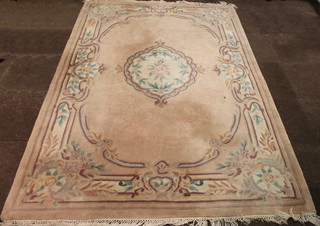 A cream ground and floral patterned Chinese rug 103" x 72"