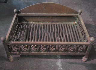 A large wrought iron fire grate 28"