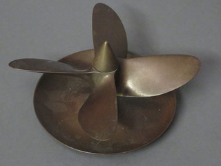 A bronze ashtray formed from a 4 bladed propeller 6"