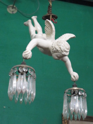 A plaster light fitting in the form of a flying cherub holding 2 lustres 13"