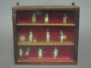 10 metal Napoleonic style figures, contained in a mahogany  display cabinet 11"