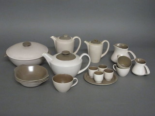 A brown glazed Poole Pottery dinner service comprising dinner plates, tureens and covers etc
