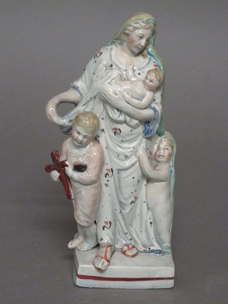 An 18th/19th Century Staffordshire figure of a standing lady with children 7"