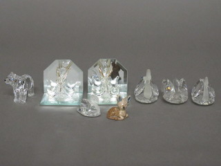 A collection of various glass figures of animals