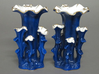 A pair of Victorian blue porcelain vases in the form of tree  stumps 6"