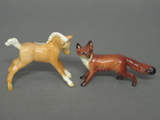 A Beswick figure of a Palomino foal 3" and do. fox 2"