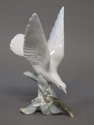 A Lladro figure of a diving dove 11"