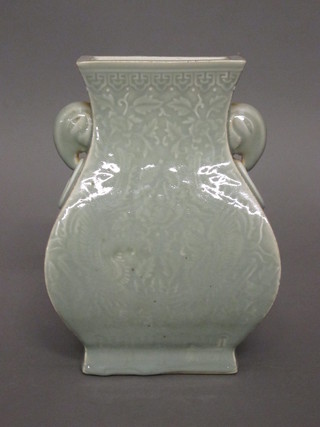 An Oriental green Celadon waisted club shaped twin handled vase 9"