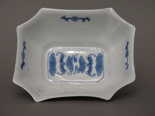 An Oriental blue porcelain shaped dish decorated figures, the base with seal mark, 7"