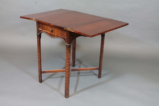 An Edwardian rectangular mahogany tea table, raised on square tapering supports with X framed stretcher 23"