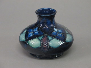 A 20th Century Moorcroft Lattice blue glazed squat shaped vase  by Sally Tuffin, the base impressed Moorcroft England AV 4"