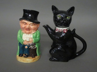 A Tony Wood teapot in the form of a black cat together with a Burlington pottery Toby jug