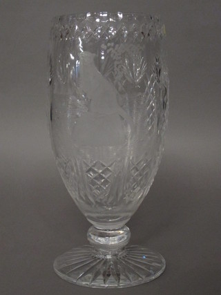 A cut glass vase raised on a circular foot, etched an otter, 13"