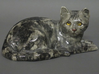 A pottery figure of a seated cat with glass eyes 12"