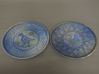 A pair of Persian style terracotta plates decorated birds 10"