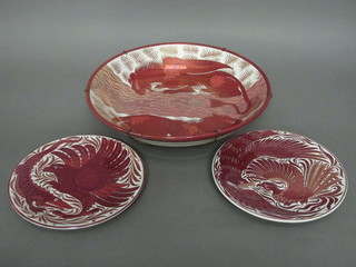 A William De Morgan  circular lustre bowl decorated fish, the reverse marked CP 16" together with a pair of similar plates,  1 cracked, 10"