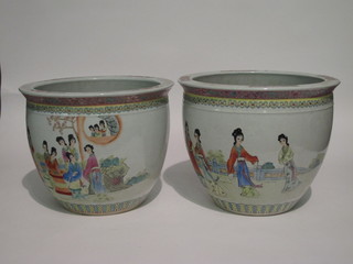A pair of Oriental fish bowls decorated court figures and with  script 15"
