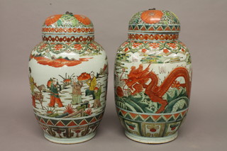 A pair of Oriental famille vert style urns and covers decorated figures, the bases with 6 character marks 17"