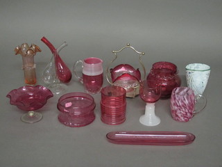 A cranberry glass bowl with silver plated mount, a cranberry glass jug 4 1/2" and a collection of various cranberry glassware