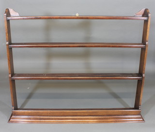 An oak 3 tier plate rack with moulded cornice 59"