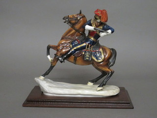 An Italian porcelain figure of a mounted Lancer 11"