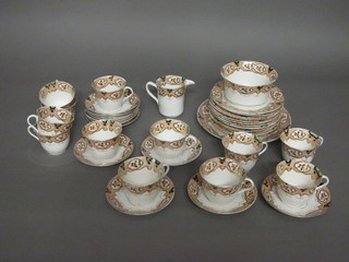 A 35 piece Royal Stafford Derby style tea service comprising 9" serving plate, 12 tea plates 7", 12 cups and 12 saucers - 6  cracked, sugar bowl - cracked, milk jug