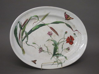 A Victorian Mintons oval pottery meat plate with floral  decoration, some crazing, 21 1/2"