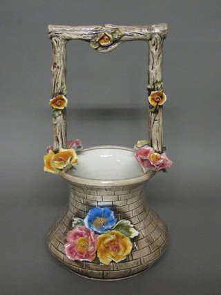 A Capo di Monte pottery basket with floral decoration 20"