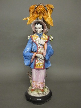 An Italian pottery figure of a standing Mandarin 29", f and r,