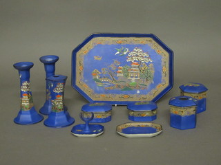An Art Deco Tams ware 10 piece dressing table set comprising  11" lozenge shaped tray, pair of candlesticks, hat pin stand, pin  tray, ring tree, hair tide and 3 trinket boxes