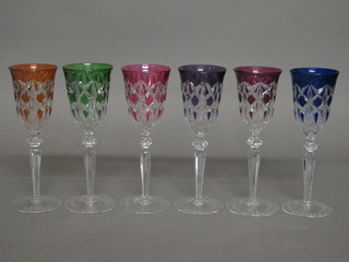 A set of 6 trumpet shaped wine glasses with coloured bowls and  cut clear glass stems