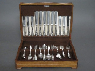 A canteen of silver plated flatware by Elkington contained in an  oak canteen box