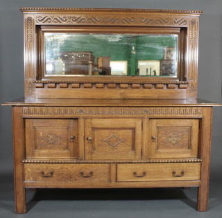 A Victorian honey oak chiffonier sideboard, the raised back fitted a rectangular bevelled plate mirror, the carved base fitted 3  cupboards above 2 long drawers, raised on square tapering  supports 72"