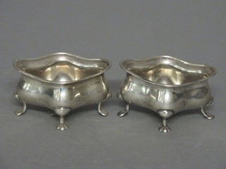 A pair of Art Nouveau shaped silver salts raised on bun feet, Birmingham 1911, 2 1/2 ozs