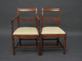 A 19th Century mahogany bar back carver chair with pierced mid  rail and upholstered drop in seat together with a matching  standard chair, raised on turned supports