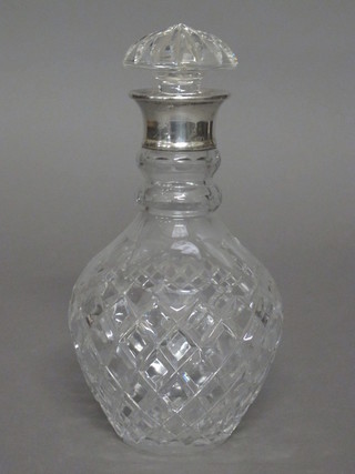 A modern cut glass mallet shaped decanter and stopper with  silver rim, marks rubbed