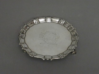 A Georgian silver card waiter with bracketed border and armorial decoration, raised on hoof feet, London 1781, 5 1/2 ozs   ILLUSTRATED