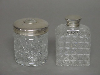 A circular hobnail cut hair tidy with silver lid with Millennium hallmark, together with a rectangular hobnail cut scent bottle with  silver lid