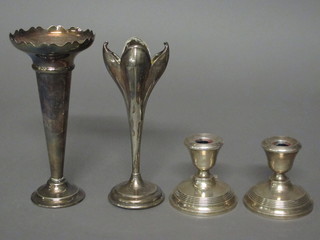 A pair of silver stub shaped candlesticks, marks rubbed 2" and a  2 silver plated specimen vases
