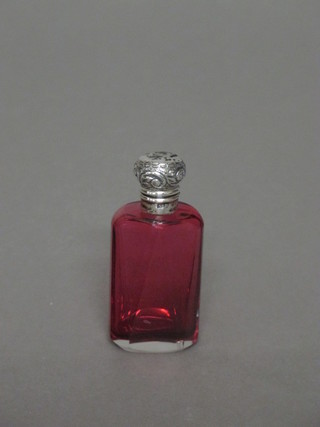 An Edwardian faceted red glass scent bottle with embossed silver  lid, Birmingham 1902, 2 1/2", stopper missing