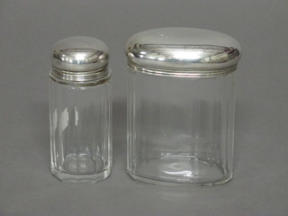 An oval panel cut glass dressing table jar with silver lid, 3"  together with a cylindrical pin jar 3", London 1907
