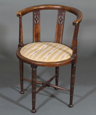 An Edwardian inlaid mahogany tub back chair, raised on turned supports