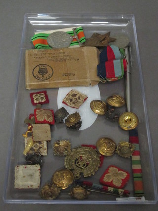 A group of 4 medals comprising 1939-45 Star, Italy Star,  Defence and War medal together with Defence medal attributable  to Mr W Kenyon of Poole and a collection of pips, badges,  buttons etc