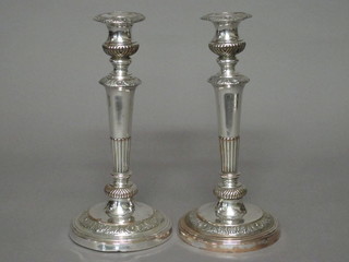 A pair of 19th Century silver plated candlesticks with detachable  sconces 11 1/2"