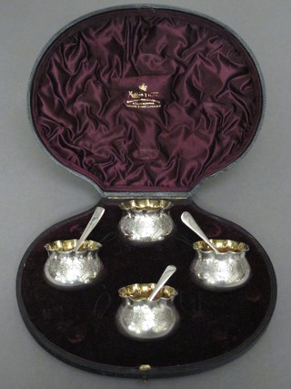A set of 4 Victorian silver plated salts by Mappin & Webb  together with associated spoons, cased  ILLUSTRATED