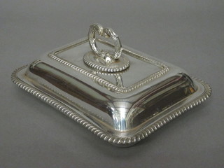 A rectangular silver plated entree dish and cover