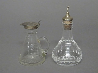 An Edwardian glass whisky tot with silver mount, Birmingham  1907 together with a glass cut glass bitters jar with silver mount